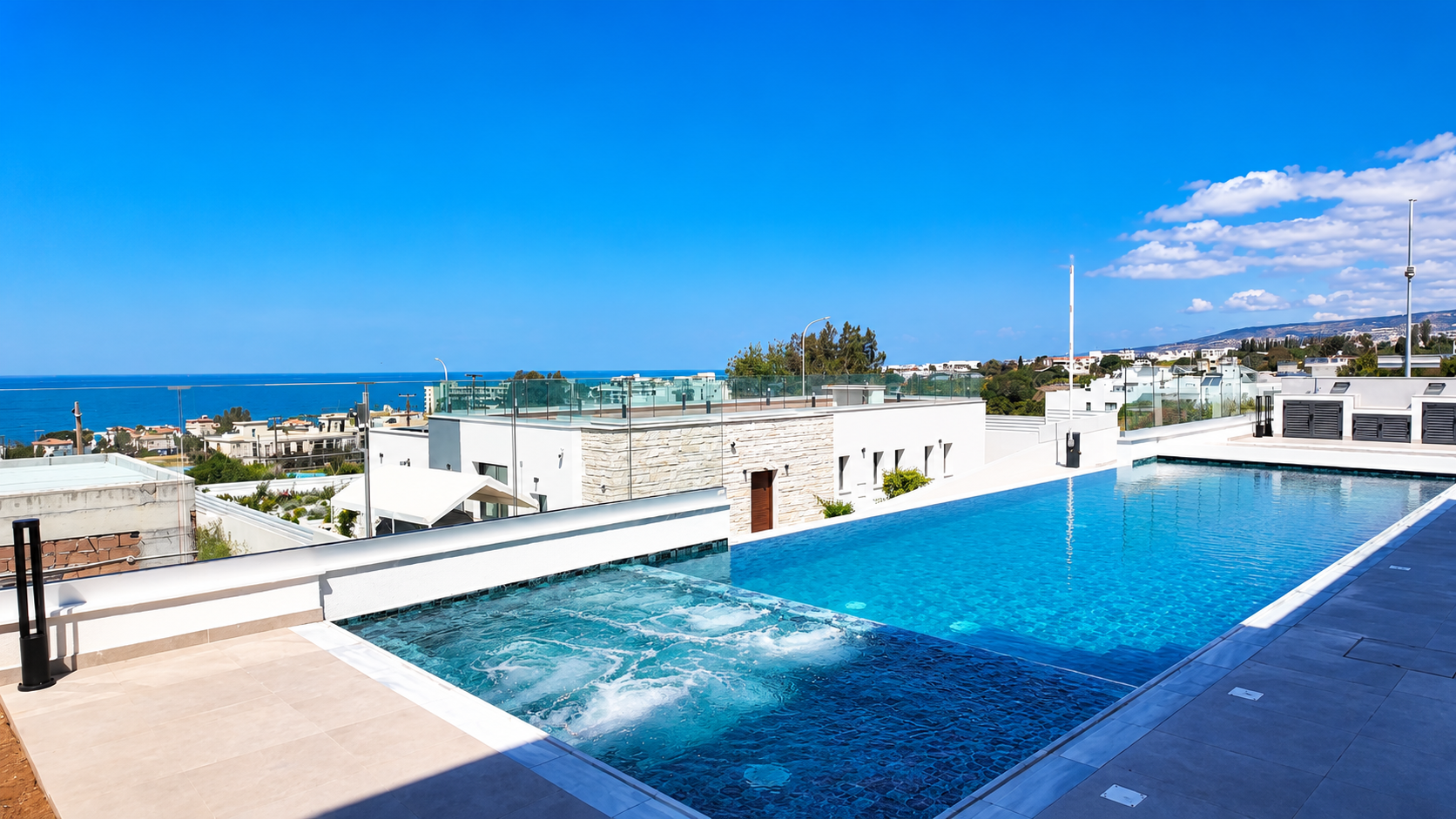 Rooftop infinity pool overlooking Paphos coastline at a Domenica Group residence